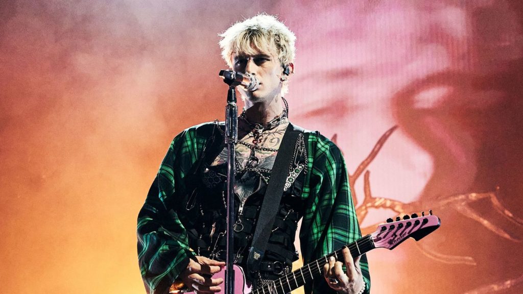Machine Gun Kelly Lays Flowers On A Fiery Grave At The VMAs
