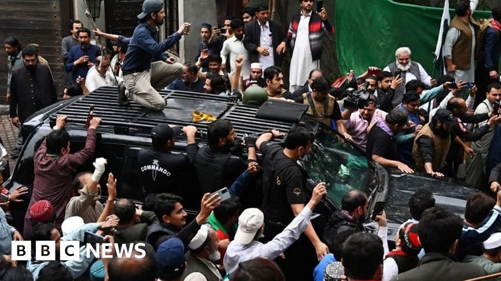 Imran Khan mobbed by supporters as he leaves for court